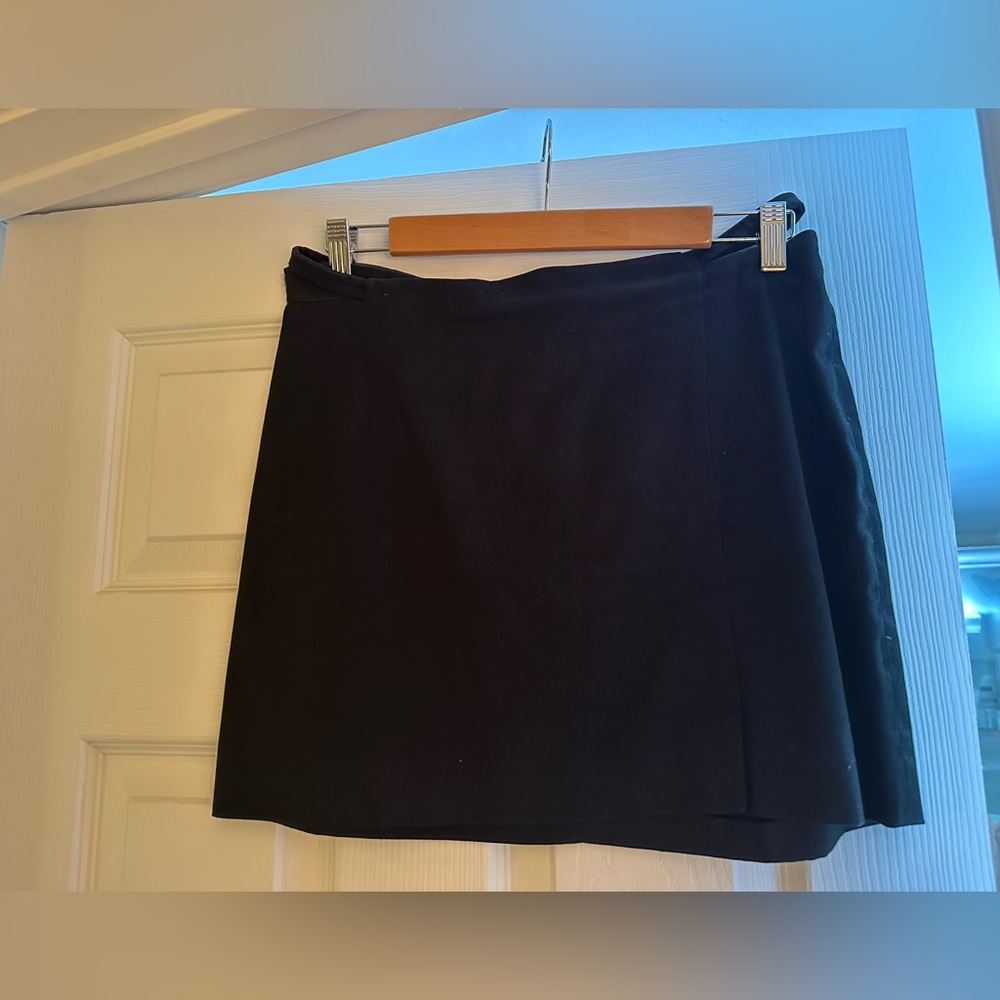 Black miniskirt by designer Tufi Duek